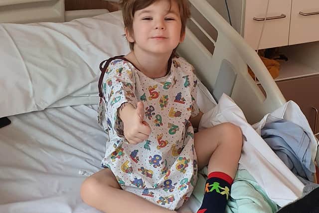 Six-year-old Seb gives the thumbs up after an operation at Alder Hey Children's Hospital earlier this year