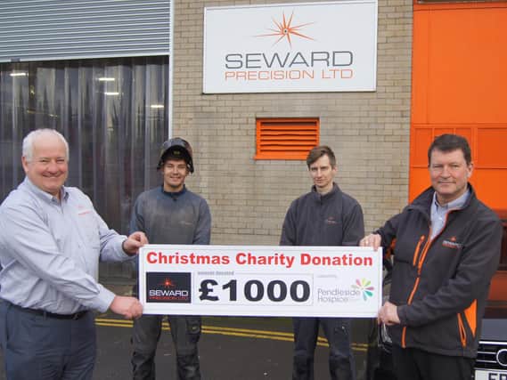 Steve MacDonald, Jacob Thornton, Ryan Atkinson and Stuart Brown with the cheque for the hospice