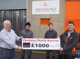 Steve MacDonald, Jacob Thornton, Ryan Atkinson and Stuart Brown with the cheque for the hospice