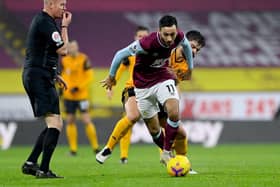 Referee Lee Mason blows his whistle before the challenge is made between Dwight McNeil of Burnley and Ruben Neves of Wolverhampton Wanderers during the Premier League match between Burnley and Wolverhampton Wanderers at Turf Moor..
