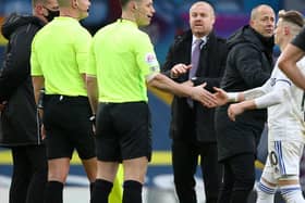 Burnley's English manager Sean Dyche (C) waits to speak with the officials after the English Premier League football match between Leeds United and Burnley at Elland Road in Leeds, northern England on December 27, 2020. - Leeds won the game 1-0.