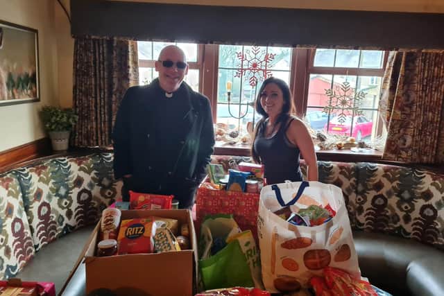 Toni-Anne prepares to hand over some of the food donated by Hare and Hounds customers and Padiham residents to Pastor Mick Fleming of Church on the Street.