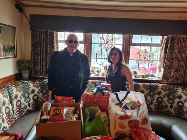 Toni-Anne prepares to hand over some of the food donated by Hare and Hounds customers and Padiham residents to Pastor Mick Fleming of Church on the Street.