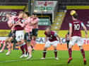 Ben Mee of Burnley scores his team's first goal during the Premier League match between Burnley and Sheffield United at Turf Moor on December 29, 2020 in Burnley, England.