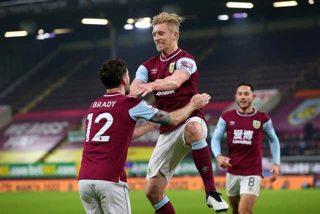 Ben Mee of Burnley celebrates with teammate Robbie Brady after scoring his team's first goal during the Premier League match between Burnley and Sheffield United at Turf Moor on December 29, 2020 in Burnley, England.