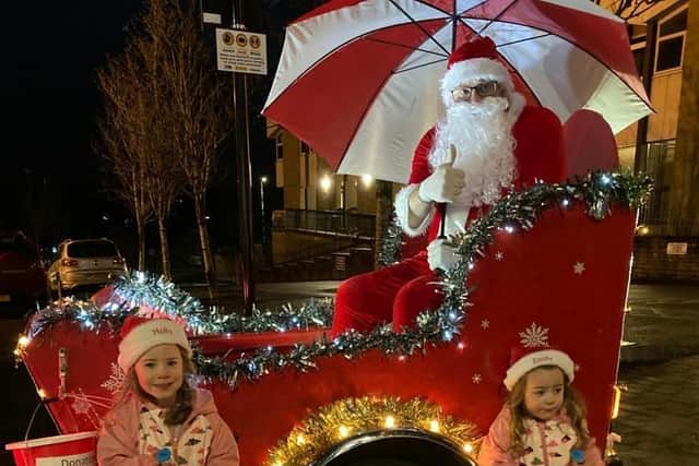 Santa, his sleigh and two little helpers