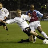 Arthur Gnohere of Burnley clashes with Luke Chadwick of Man Utd during the Burnley v Manchester United Worthington Cup, Fourth Round match at Turf Moor on December 3, 2002 in Burnley, England.