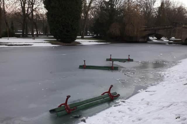 Andy Robinson took this photograph of three of the the benches on the ice at the lake in Burnley's Thompson Park.
