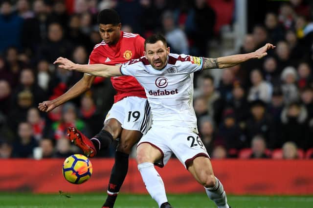 Marcus Rashford of Manchester United and Phil Bardsley of Burnley during the Premier League match between Manchester United and Burnley at Old Trafford on December 26, 2017 in Manchester, England.