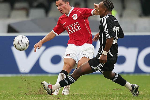England's Manchester United Phil Bardsley gets the ball off Gift Leremi of Orlando Pirates during the Vodacom Challenge friendly match in Durban 15 July 2006 at Absa Stadium. Mancherter won 4-0.