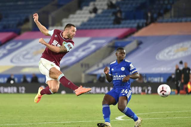 Phil Bardsley of Burnley shoots past Nampalys Mendy of Leicester City during the Premier League match between Leicester City and Burnley at The King Power Stadium on September 20, 2020 in Leicester, England.