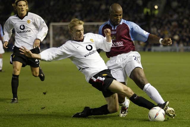 Arthur Gnohere of Burnley clashes with Luke Chadwick of Man Utd during the Burnley v Manchester United Worthington Cup, Fourth Round match at Turf Moor on December 3, 2002 in Burnley, England.