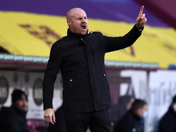 Burnley's English manager Sean Dyche shouts instructions to his players from the touchline during the English Premier League football match between Burnley and Everton at Turf Moor in Burnley, north west England on December 5, 2020.