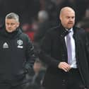 Burnley's English manager Sean Dyche (R) and Manchester United's Norwegian manager Ole Gunnar Solskjaer leave the pitch at half time during the English Premier League match at Old Trafford on January 22, 2020.