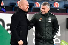 Burnley's English manager Sean Dyche (L) greets Manchester United's Norwegian manager Ole Gunnar Solskjaer during the English Premier League football match  at Turf Moor in Burnley, north west England on January 12, 2021.