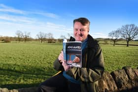 John Poulton pictured with his new book    Photo: Neil Cross