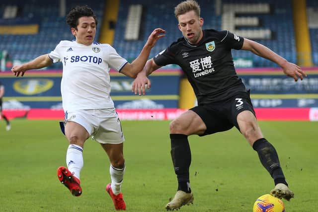 Burnley's English defender Charlie Taylor (R) vies with Leeds United's English midfielder Ian Poveda (L) during the English Premier League football match at Elland Road in Leeds, northern England on December 27, 2020.