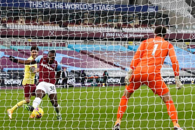 Michail Antonio of West Ham United scores his team's first goal past Nick Pope of Burnley during the Premier League match between West Ham United and Burnley at London Stadium on January 16, 2021 in London, England.