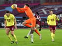 Nick Pope of Burnley collects the ball under pressure from Michail Antonio of West Ham United during the Premier League match between West Ham United and Burnley at London Stadium on January 16, 2021 in London, England.