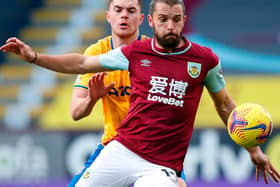 Everton's English defender Michael Keane (L) vies with Burnley's English striker Jay Rodriguez during the English Premier League football match between Burnley and Everton at Turf Moor in Burnley, north west England on December 5, 2020.