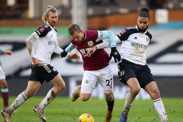 Matej Vydra of Burnley is fouled by Michael Hector of Fulham, leading to a penalty to Burnley during The Emirates FA Cup Fourth Round match between Fulham and Burnley at London Stadium on January 24, 2021 in London, England.