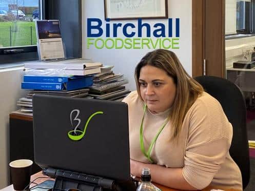 A member of the team at Birchall Foodservice mans the phone lines for Burnley Together