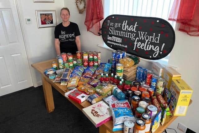 Karen with the food items donated by her Slimming World class members