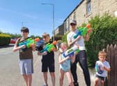 Ready for a summer water fight, residents in Rosegrove taking part in one of the lockdown activities organised by the neighbourhood watch group.
