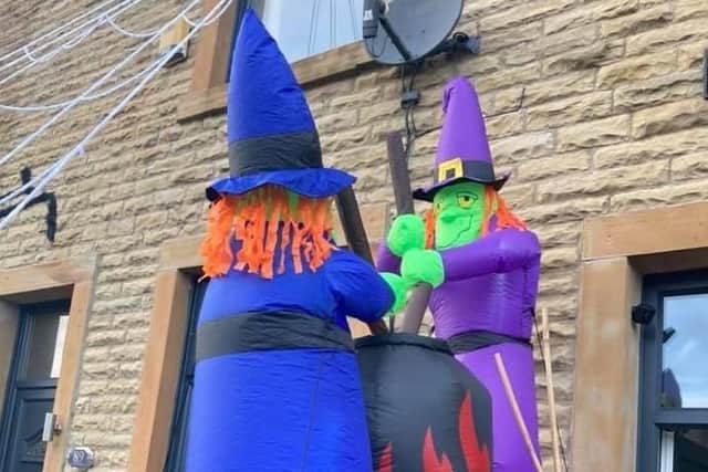 Two witches stir their cauldron, just one of the spectacular Hallowe'en displays created by residents in Rosegrove