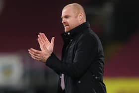 Burnley's English manager Sean Dyche applauds after the English Premier League football match between Burnley and Aston Villa at Turf Moor in Burnley, north west England on January 27, 2021.