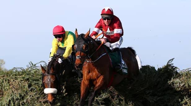 Davy Russell riding Tiger Roll clears the final fence as he races to victory in the 2019 Randox Health Grand National at Aintree