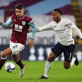 Burnley's English defender Matthew Lowton vies with Manchester City's English midfielder Raheem Sterling during the English League Cup fourth round football match at Turf Moor in Burnley, north west England on September 30, 2020.