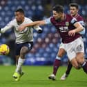 Gabriel Jesus of Manchester City battles for possession with James Tarkowski of Burnley during the Premier League match between Burnley and Manchester City at Turf Moor on February 03, 2021 in Burnley, England.