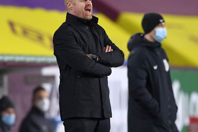 Burnley's English manager Sean Dyche shouts instructions to his players from the touchline during the English Premier League football match between Burnley and Manchester City at Turf Moor in Burnley, north west England on February 3, 2021.