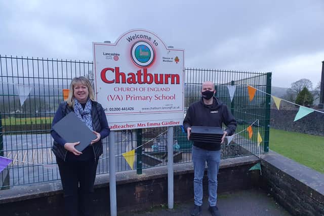 Rapid IT’s Client Experience Director, Chris Stevenson donating laptops to headteacher at Chatburn C of E Primary School, Mrs Emma Gardiner