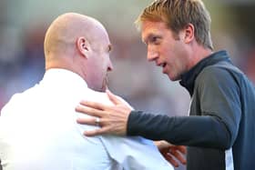 Graham Potter, Manager of Brighton and Hove Albion, greets Sean Dyche, Manager of Burnley, prior to the Premier League match at American Express Community Stadium on September 14, 2019 in Brighton, United Kingdom.
