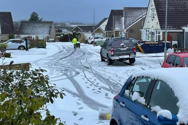 Alex's photo of 'Milk Tray man' Wajid Hussain who made sure her Asda shop was delivered after helping a couple whose car was stuck in the snow