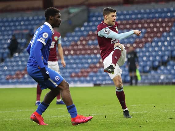 Johann Gudmundsson of Burnley scores his team's first goal during the Premier League match between Burnley and Brighton & Hove Albion at Turf Moor on February 06, 2021 in Burnley, England.