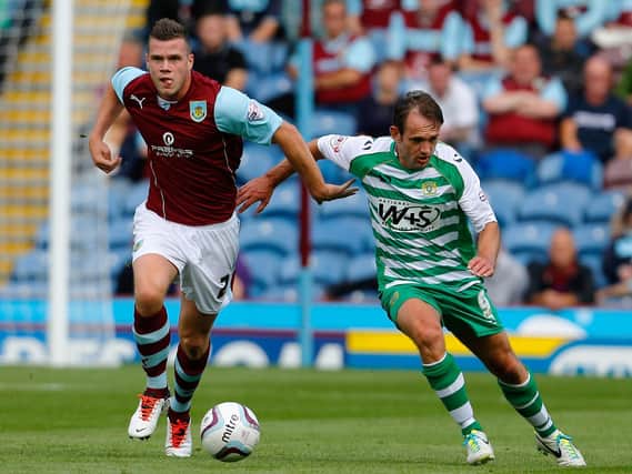 Kevin Long (L) of Burnley in action with James Hayter of Yeovil during the Sky Bet Championship match between Burnley and Yeovil Town at Turf Moor on August 17, 2013 in Burnley, England