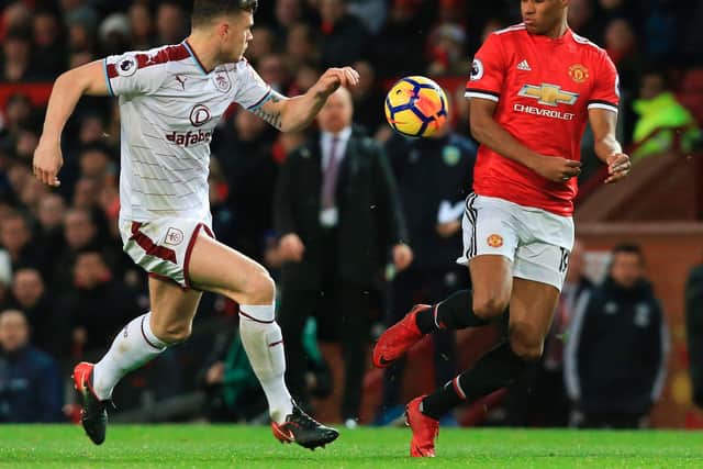 Burnley's Irish defender Kevin Long (L) and Manchester United's English striker Marcus Rashford (R) vie for the ball during the English Premier League football match at Old Trafford in Manchester, north west England, on December 26, 2017.