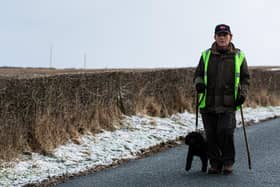 Philip with his four-legged friend Freddie completing his epic walking challenge for a good cause