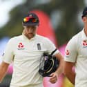 Joe Root and James Anderson of England look dejected in defeat on Day Three of the 2nd Test match between West Indies and England at Sir Vivian Richards Stadium on February 02, 2019 in St John's, Antigua and Barbuda.