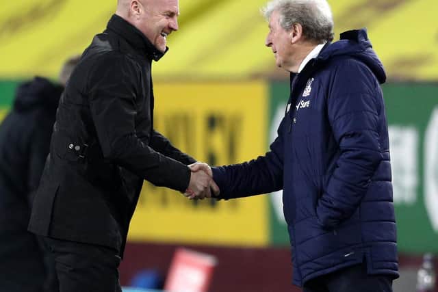 Burnley's English manager Sean Dyche (L) greets Crystal Palace's English manager Roy Hodgson (R) ahead of the English Premier League football match between Burnley and Crystal Palace at Turf Moor in Burnley, north west England on November 23, 2020.