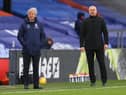 Crystal Palace's English manager Roy Hodgson (L) and Burnley's English manager Sean Dyche look on from the side-lines during the English Premier League football match between Crystal Palace and Burnley at Selhurst Park in south London on February 13, 2021.