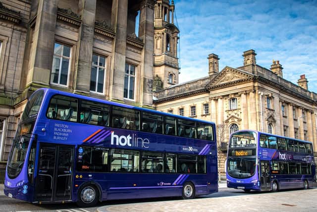 Two of Transdev’s new-look Hotline buses in front of the Harris Museum and Sessions House in Preston City Centre. Lancashire’s Hotline inter-urban bus service, linking Preston, Blackburn and Burnley, now features new-look buses including at-seat power points, next stop announcements and low emission engines.