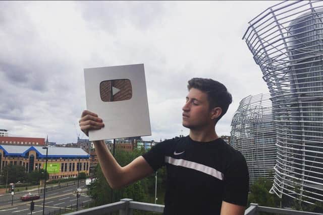 Vizeh with his plaque for 100,000 YouTube subscribers