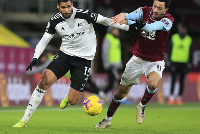 Fulham's English midfielder Ruben Loftus-Cheek (L) vies with Burnley's English midfielder Dwight McNeil during the English Premier League football match between Burnley and Fulham at Turf Moor in Burnley, north west England on February 17, 2021.