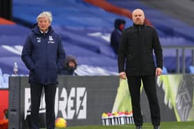 Crystal Palace's English manager Roy Hodgson (L) and Burnley's English manager Sean Dyche look on from the side-lines during the English Premier League football match between Crystal Palace and Burnley at Selhurst Park in south London on February 13, 2021.