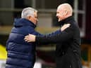 Burnley's English manager Sean Dyche (R) greets Tottenham Hotspur's Portuguese head coach Jose Mourinho (L) ahead of the English Premier League football match at Turf Moor in Burnley, north west England on October 26, 2020.