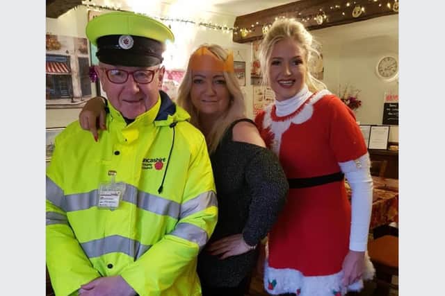 Lollipop man Peter at a Christmas meal event with Bernadette Carroll and Charlotte Morris